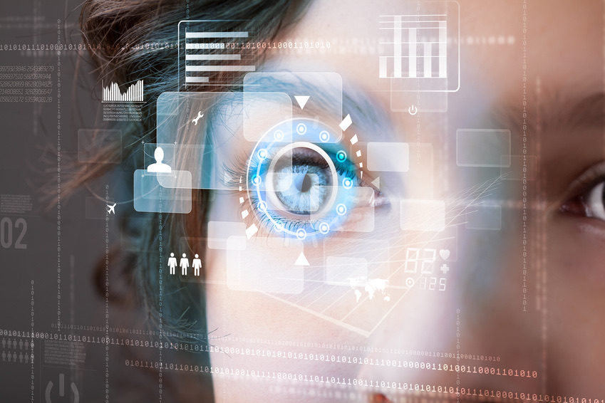 woman's eye looking through digital transparent screen